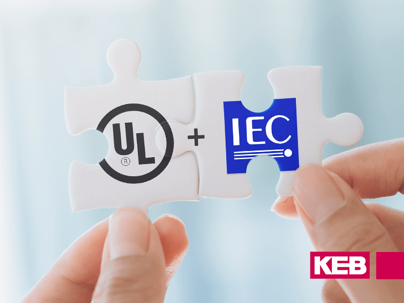 UL and IEC logos connecting on puzzle pieces for UL 61800-5-1 standards